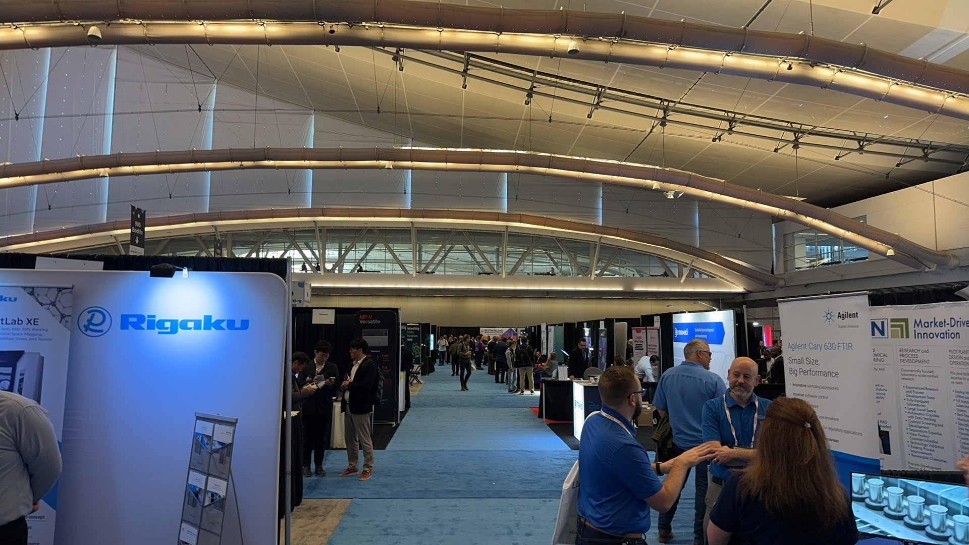 Main exhibition hall with attendees and exhibitors