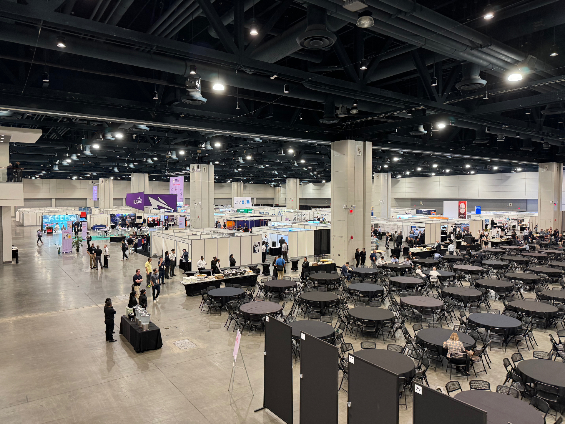 Wide overview of the ICSCRM 2024 exhibition and dining hall inside the Raleigh Convention Center