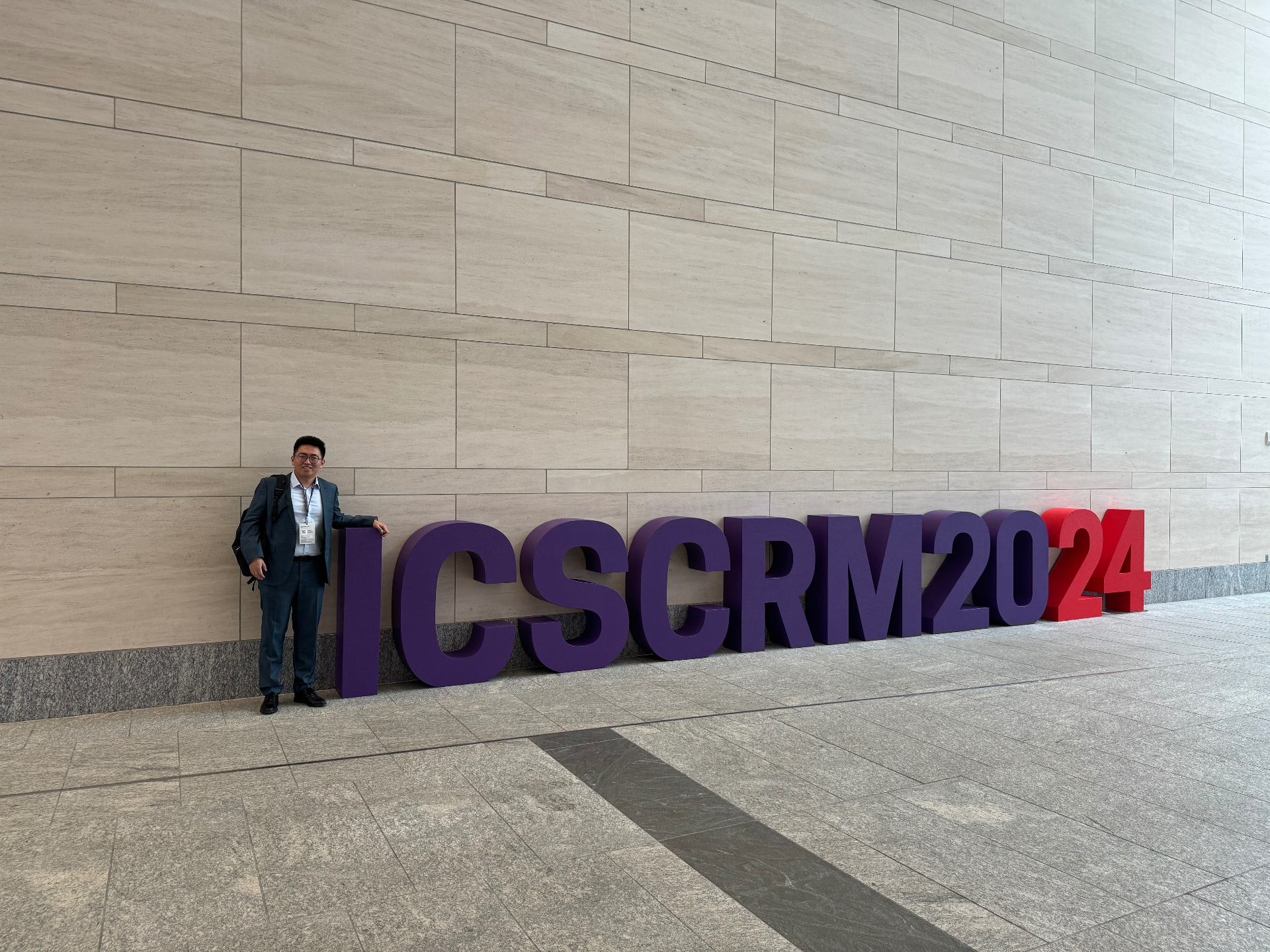 ICSCRM 2024 large venue sign with attendee photo in Raleigh, North Carolina