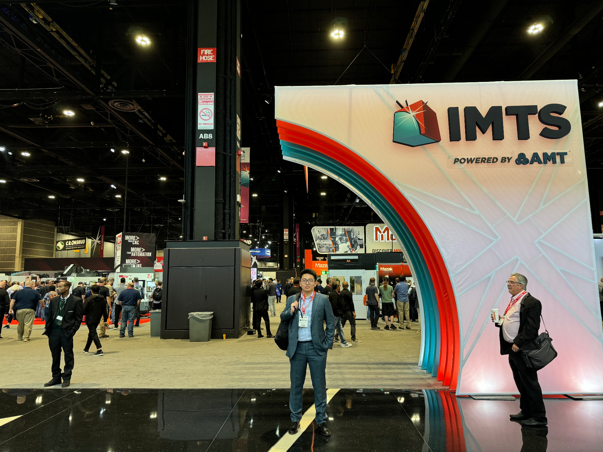 Attendee photo in front of the IMTS 2024 entrance installation at McCormick Place Chicago