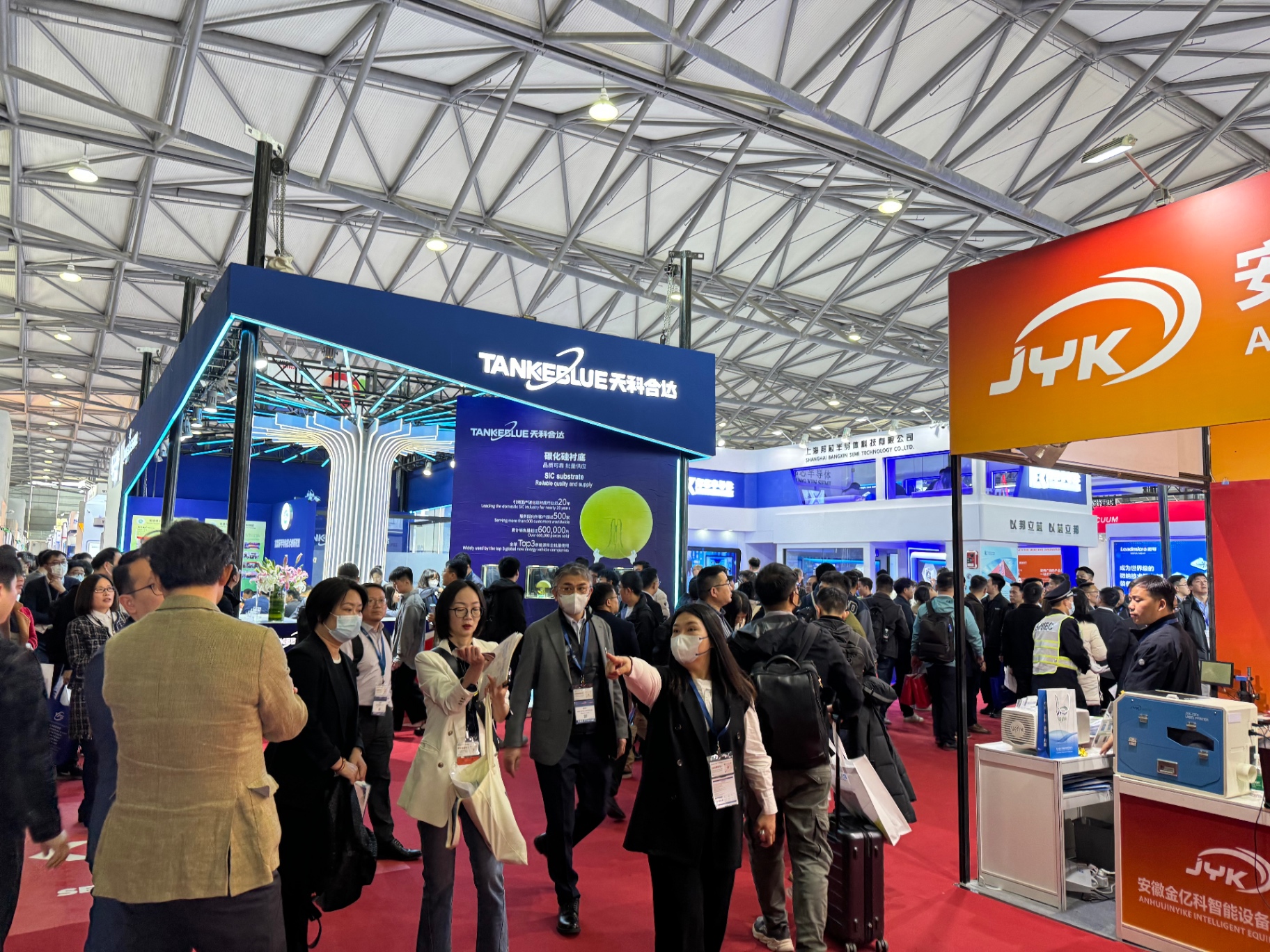 Crowded TankeBlue SiC substrate booth and JYK precision equipment area at SEMICON China 2024 in Shanghai