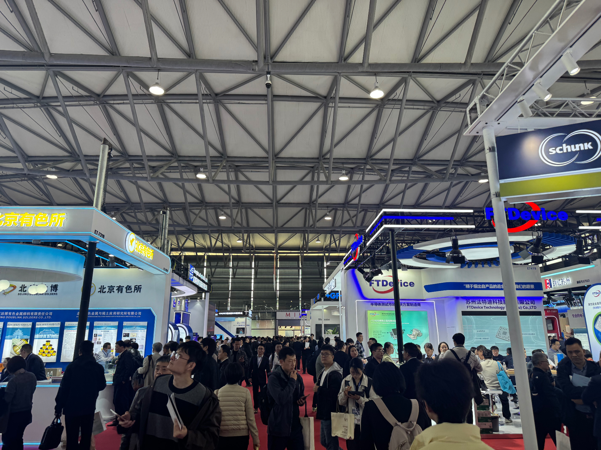 Busy exhibition hall with advanced materials and device suppliers at SEMICON China