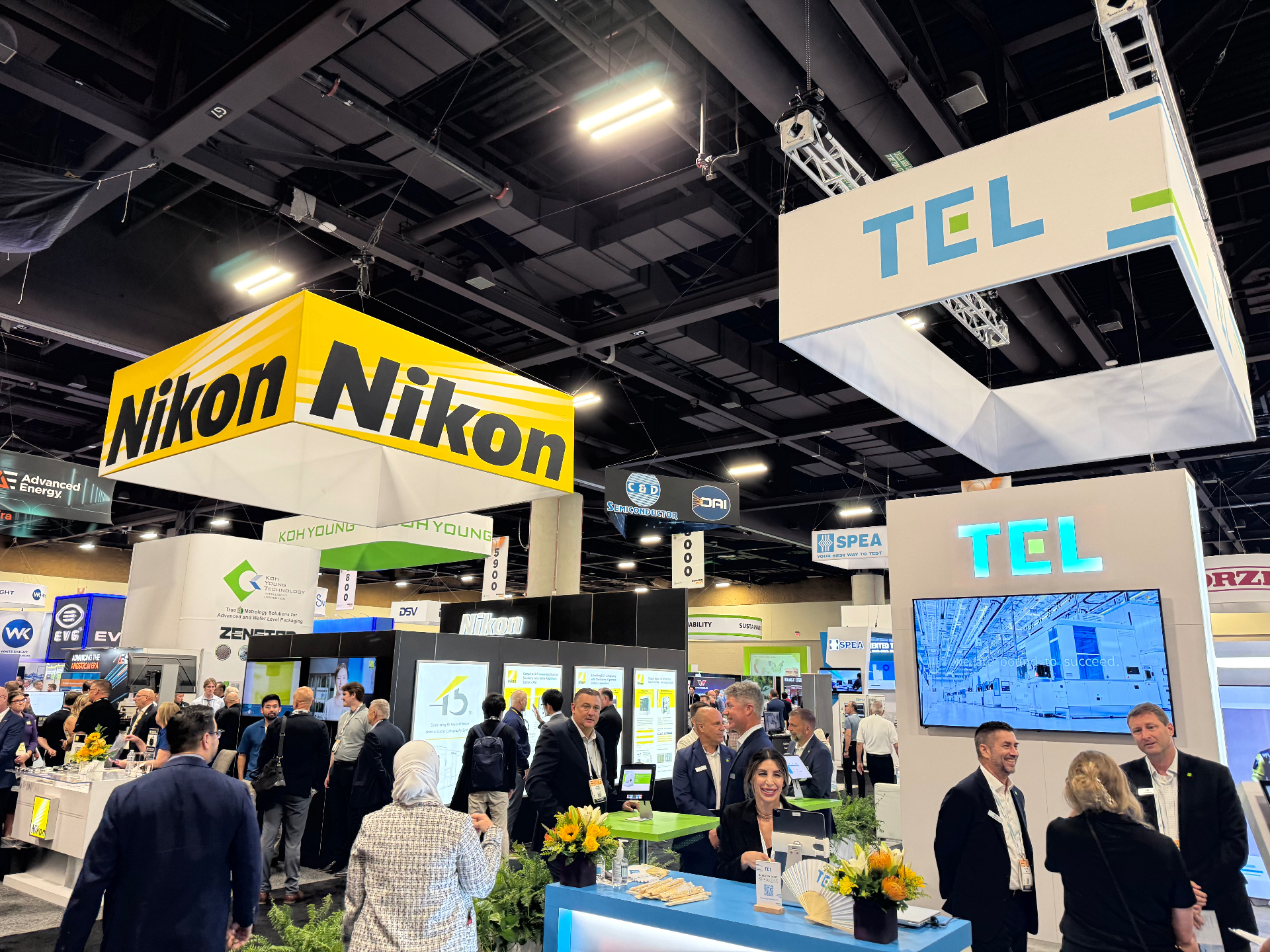 Nikon and TEL booths on the SEMICON West 2025 show floor in Phoenix