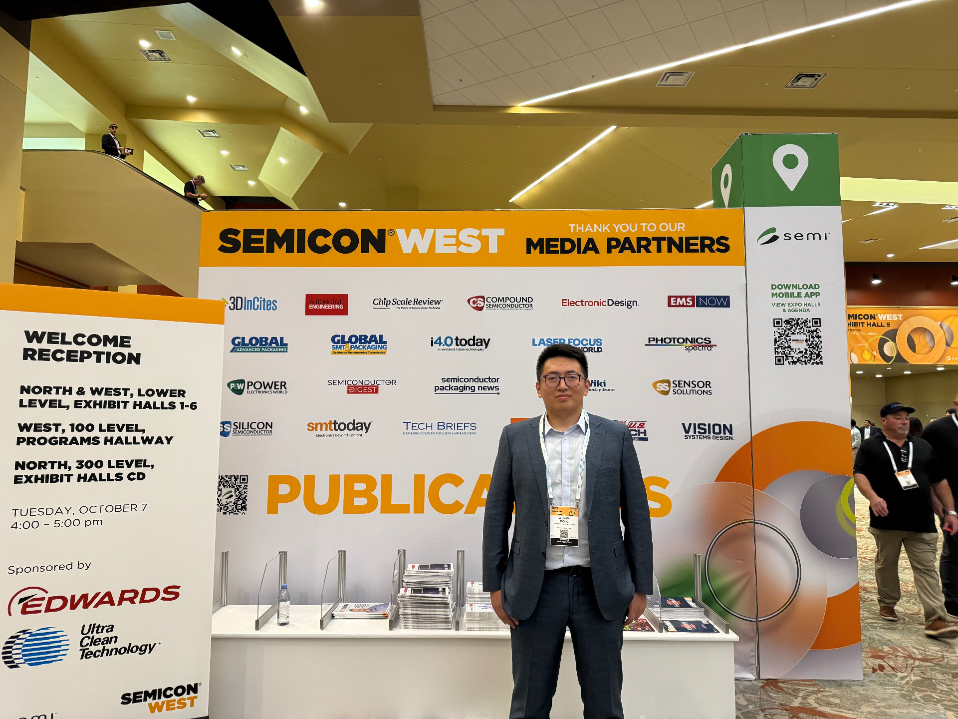 SEMICON West 2025 publications and media partners area with attendee photo in Phoenix