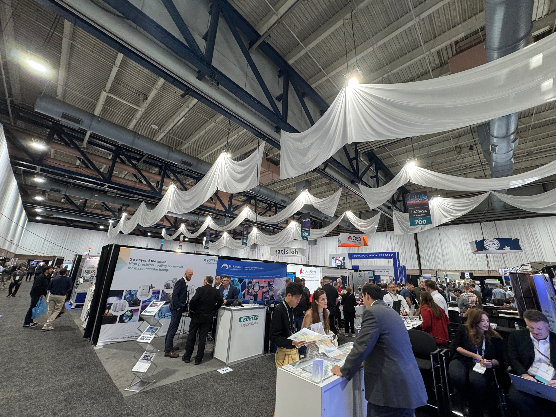 Buhler Leybold Optics, Blueridge Optics, and OptoSigma booths at SPIE Optifab 2025 in Rochester