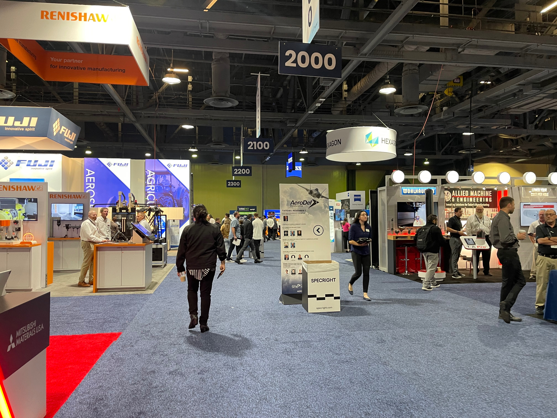 WESTEC exhibition aisle with Renishaw, Fuji, and Hexagon booths